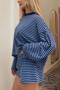 Close-up of blue and black striped long-sleeve lounge top with matching shorts set