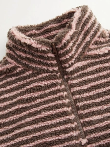 Detail of girls sherpa fleece jacket with pink and brown stripes and a sturdy zipper
