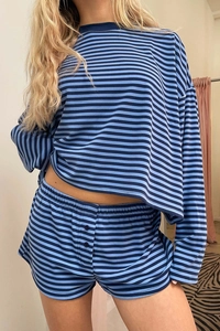 Detailed view of striped cotton lounge set featuring buttoned elastic shorts and soft knit