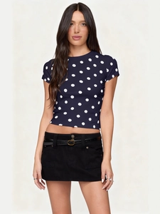 Slim fit navy blue short sleeve t-shirt with white polka dots and black denim mini skirt