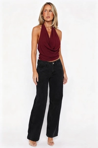 Detail of burgundy halter neck top with draped neckline and backless design for women