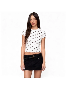Women's vintage polka dot slim fit white t-shirt paired with a black mini skirt and belt