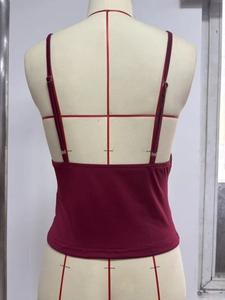 Adjustable thin straps and back detail of a wine red sequin slim-fit U-neck camisole