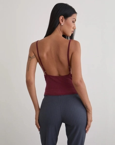 Detail of burgundy backless camisole with slim straps and metal adjusters on the back