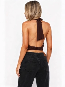 Sexy backless halter top in dark brown with lace-up detail and black high waist jeans