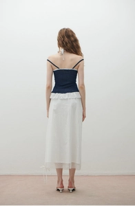 Detail of polka dot backless halter top and skirt with mesh拼接 and ruffle hemline