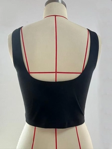 Detailed back view of a black ribbed tank top with deep U-neck cutout on a mannequin
