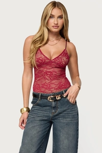 Close-up of red lace bodysuit with deep V-neck and delicate spaghetti straps for women