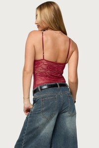 Detail of burgundy lace tank top featuring intricate floral patterns and slim straps back