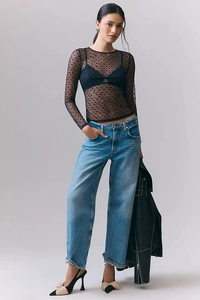 Mesh sheer long sleeve top featuring heart patterns and lace detail on plain background