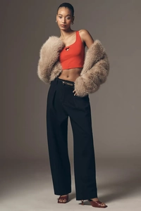 Fashion set with red heart cutout tank top, tan faux fur coat and black wide-leg trousers