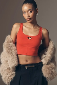 Detailed close-up of a red slim fit tank top featuring a trendy heart-shaped cutout design