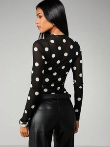 Women's chic black sheer mesh long sleeve top with white polka dots and crew neck