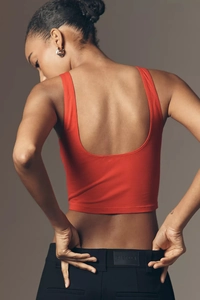 Rear view of red backless crop top with deep U-cut design and slim fit knit fabric