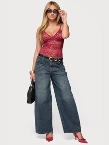 Red lace corset top with V-neck and high-waisted wide-leg jeans outfit for women