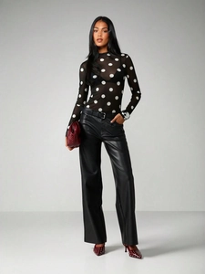 Chic sheer mesh polka dot top styled with faux leather wide leg pants and burgundy accessories
