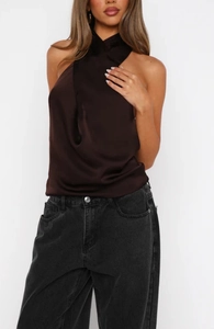 Detail of elegant chocolate brown satin halter neck top with soft draped texture