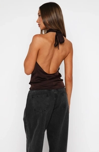 Detail of dark brown satin halter top with open back and elegant neck bow tie