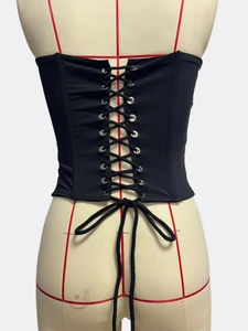 Detailed back view of black corset top showing silver eyelets and adjustable lace-up ties