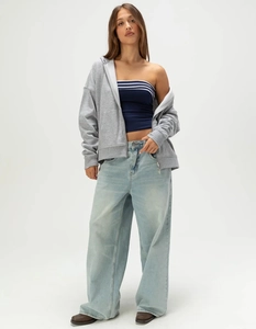 Detailed view of casual American street style with grey hoodie and striped tube top