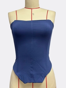 Detail of navy blue slim fit bodysuit showing vertical seams and corset-style structure