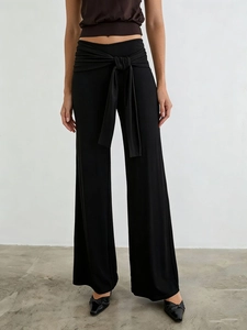 High waist black wide leg trousers for women featuring a stylish waist tie knot detail