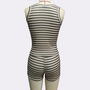 Detail view showing the ribbed knit fabric and back design of this striped two-piece outfit