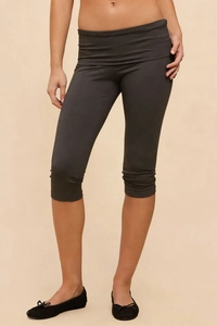 Detailed close-up of dark grey high-waisted cropped leggings with folded hem design