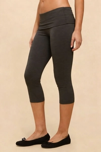 Detailed macro shot of dark grey slim-fit yoga leggings with high waist and knit texture