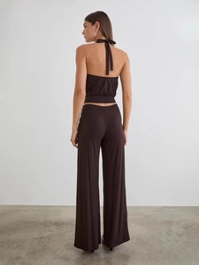 Deep brown two-piece set featuring a halter crop top and high waist wide leg trousers