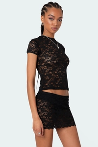 Detailed view of semi-transparent floral lace texture and intricate crochet embroidery