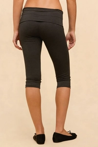 Macro shot of dark grey cropped leggings featuring a stylish high-rise foldover waistband