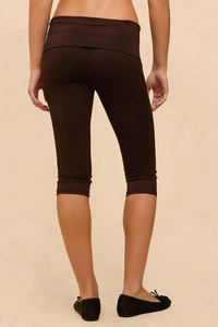 Rear view of dark brown high-waisted capri yoga pants with wide fold-over waistband