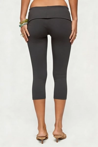 Rear view of dark grey high waisted capri yoga leggings showing V-cut waist detail