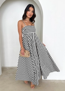 Detailed view of the multi-directional black and white stripes on a high waist maxi dress