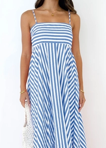 Detail of blue and white striped summer sundress with horizontal and vertical patterns