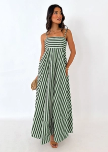 Detail of green and black striped maxi dress showing waist cinching and A-line silhouette