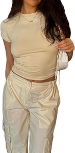 Detail of beige slim fit t-shirt paired with matching cargo pants and pocket detail