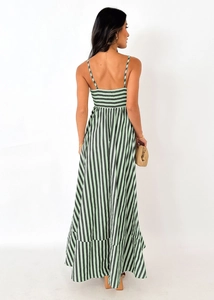 Back view of a striped halter maxi dress with shirred elastic bodice and ruffled hemline