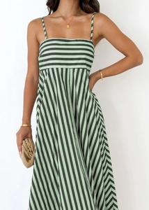 Detail of green and black striped camisole dress with vertical skirt pattern