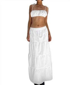 White two-piece summer set with cropped tie-front top and high-waist tiered maxi skirt