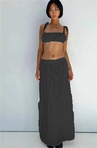 Detail of grey cropped camisole top and high-waisted tiered maxi skirt set for women