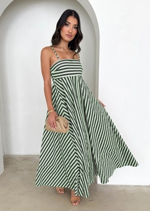 Detail of green and black striped maxi dress showing high waist and flowy fabric texture