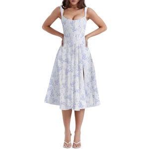 Detail of white floral summer dress with blue flower prints and corset style waist design