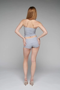 Rear view detail of a slim-fit grey high-waisted shorts and tube top set for women