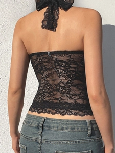 Slim fit black lace halter top with open back and intricate embroidery patterns
