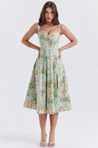 Detail of light green floral dress with corset bodice and side slit design