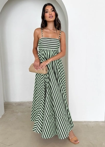 Detailed view of the green and black striped maxi dress with thin straps and a wide hem