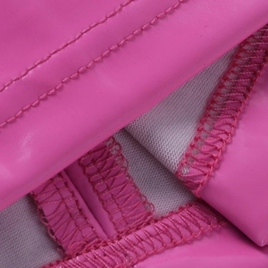 Detail of hot pink faux leather dress showing precision double stitching and inner lining