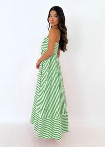 Detail of green and white striped stitching and flowing hem on summer maxi dress